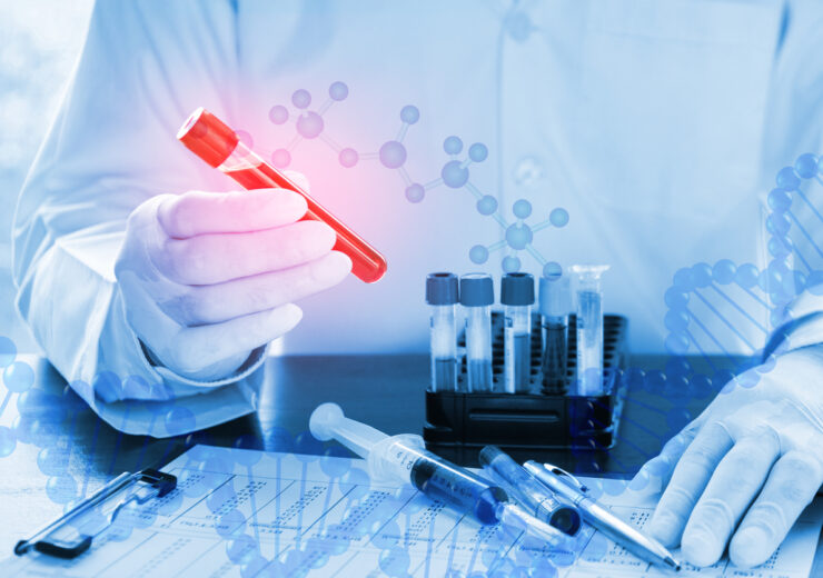 Double exposure of close up of DNA testing of the blood